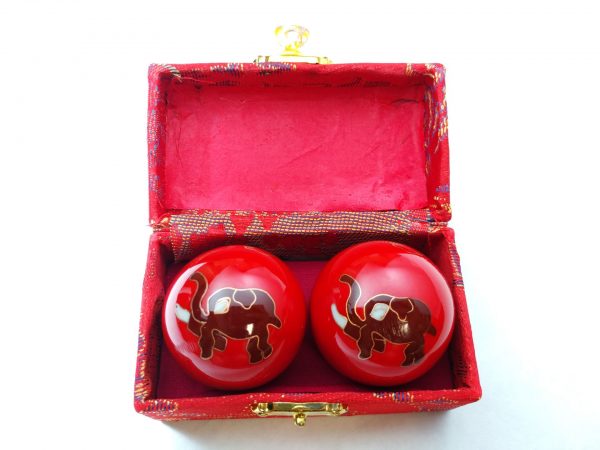 Red baoding balls with elephant design in a box