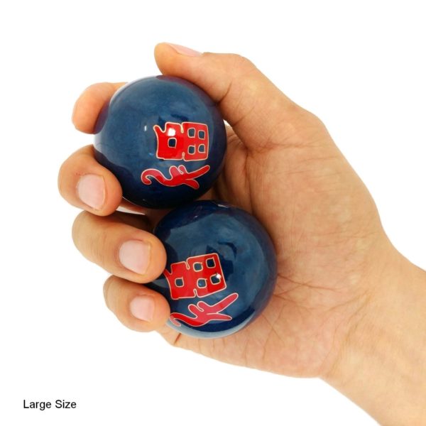 Hand holding large good fortune baoding balls