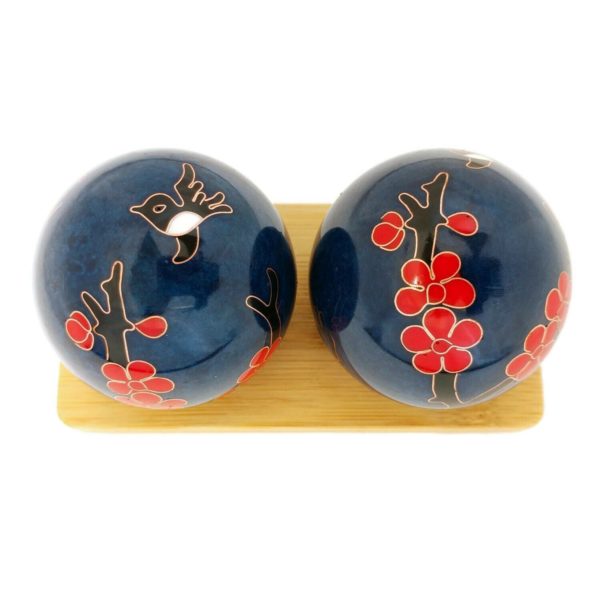 Hummingbird baoding balls on a display stand