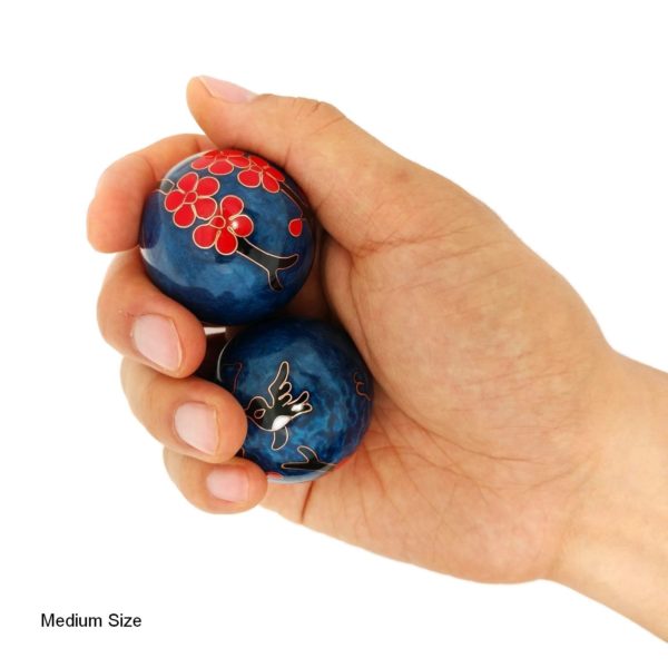 Hand holding medium hummingbird baoding balls