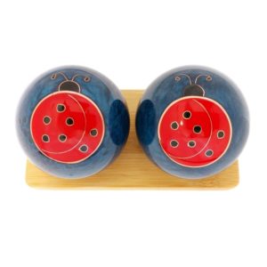 Ladybug baoding balls on a display stand