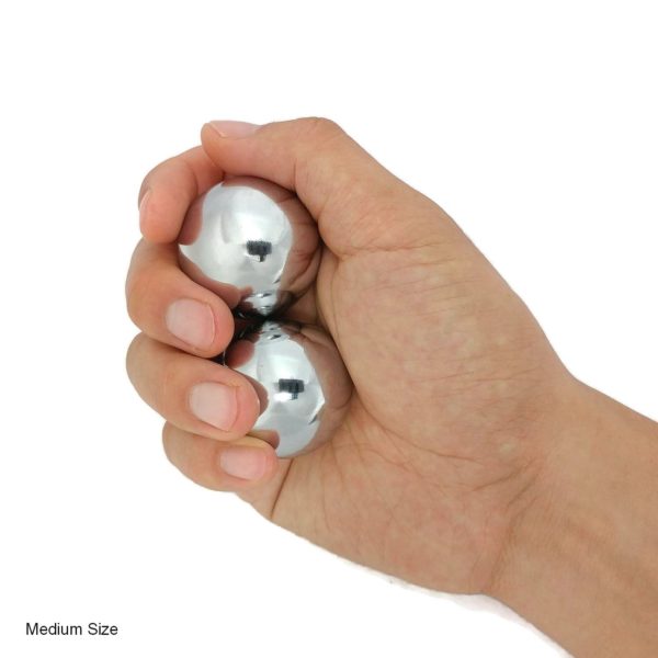 Hand holding chrome baoding balls