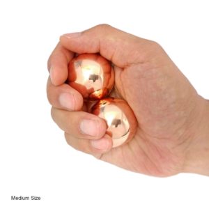 Hand holding medium copper baoding balls