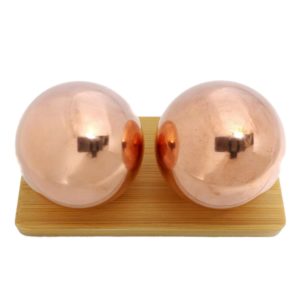 Copper baoding balls on bamboo display stand