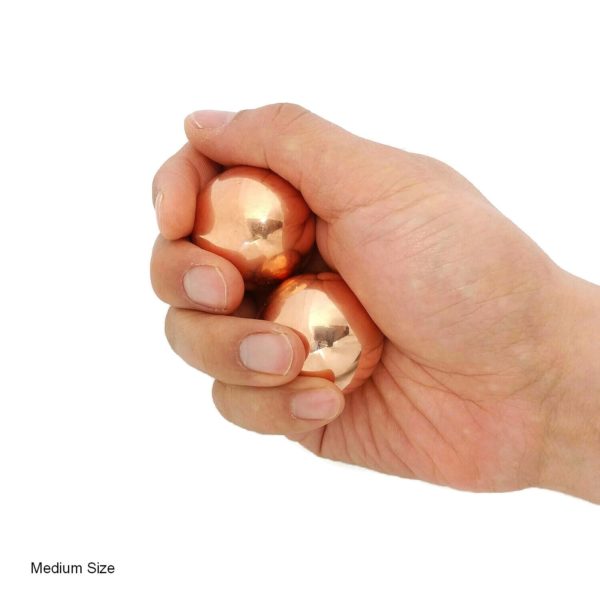 Hand holding medium copper baoding balls