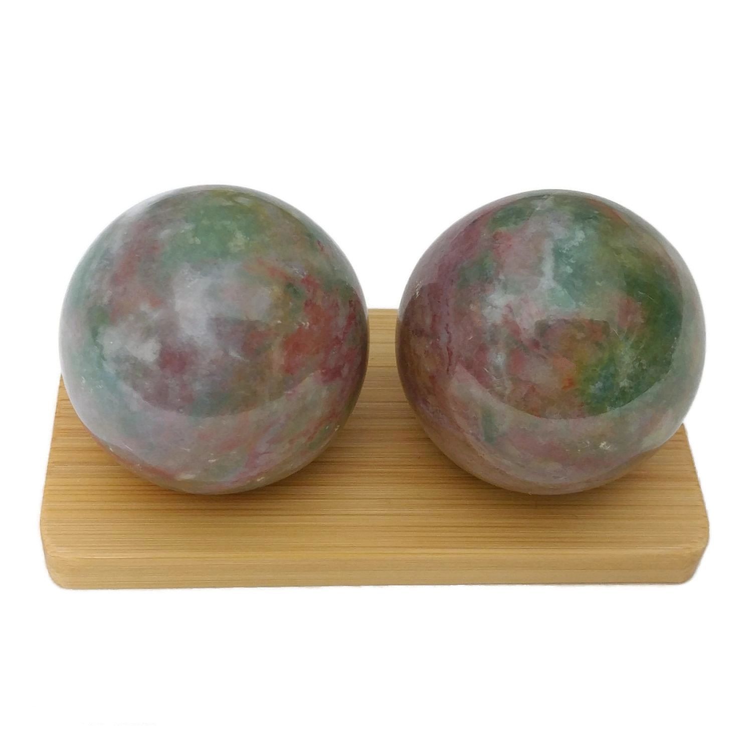 Fancy jasper baoding balls on a bamboo display stand