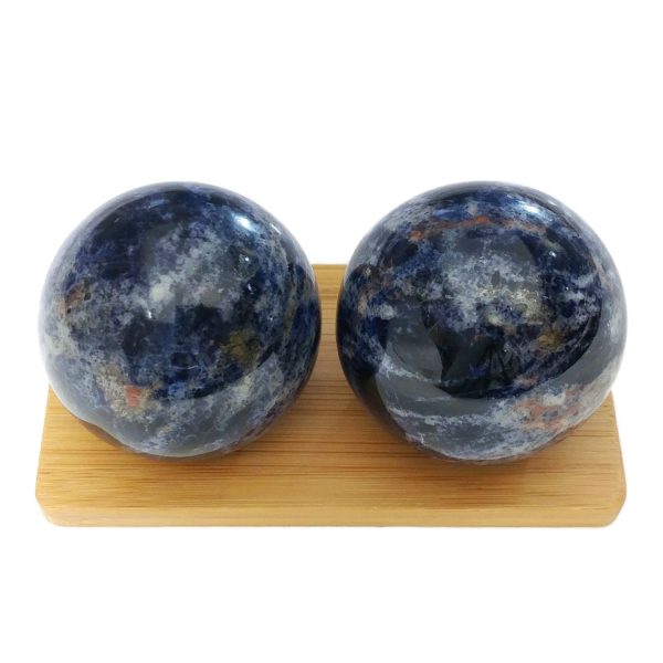 Sodalite baoding balls on a display stand