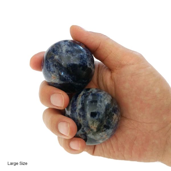 Hand holding large sodalite baoding balls