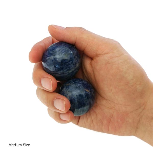 Hand holding medium sodalite baoding balls