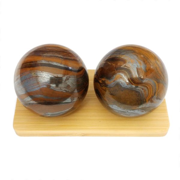 Tiger iron baoding balls on a bamboo display stand