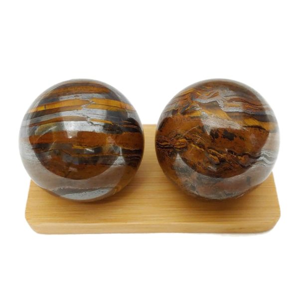 Tiger iron baoding balls on a bamboo display stand