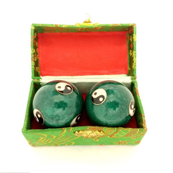 Green baoding balls with yin yang design in a box