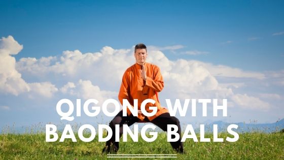 Man doing qigong with text Qigong with Baoding Balls