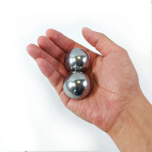 Hand holding 1.5" solid stainless steel baoding balls