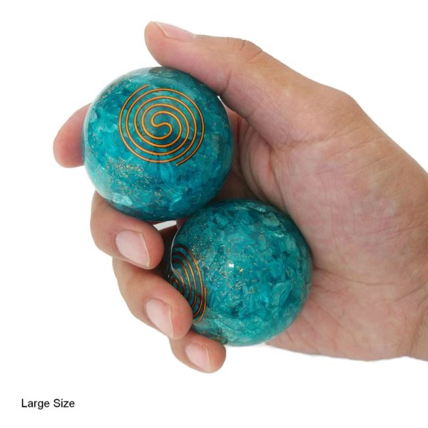 Hand holding Aquamarine Quartz Baoding Balls