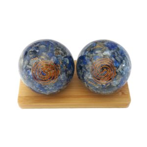 Lapis lazuli orgonite baoding balls on a display stand