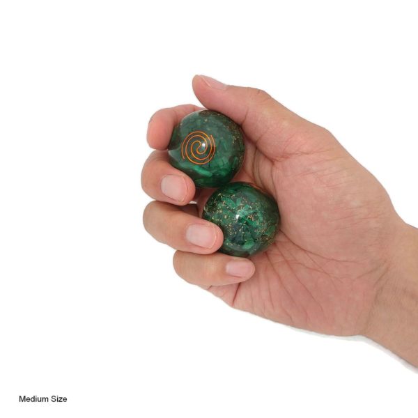 Hand holding Malachite baoding balls