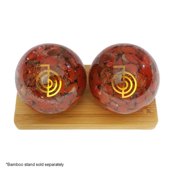Red jasper orgonite baoding balls on bamboo stand