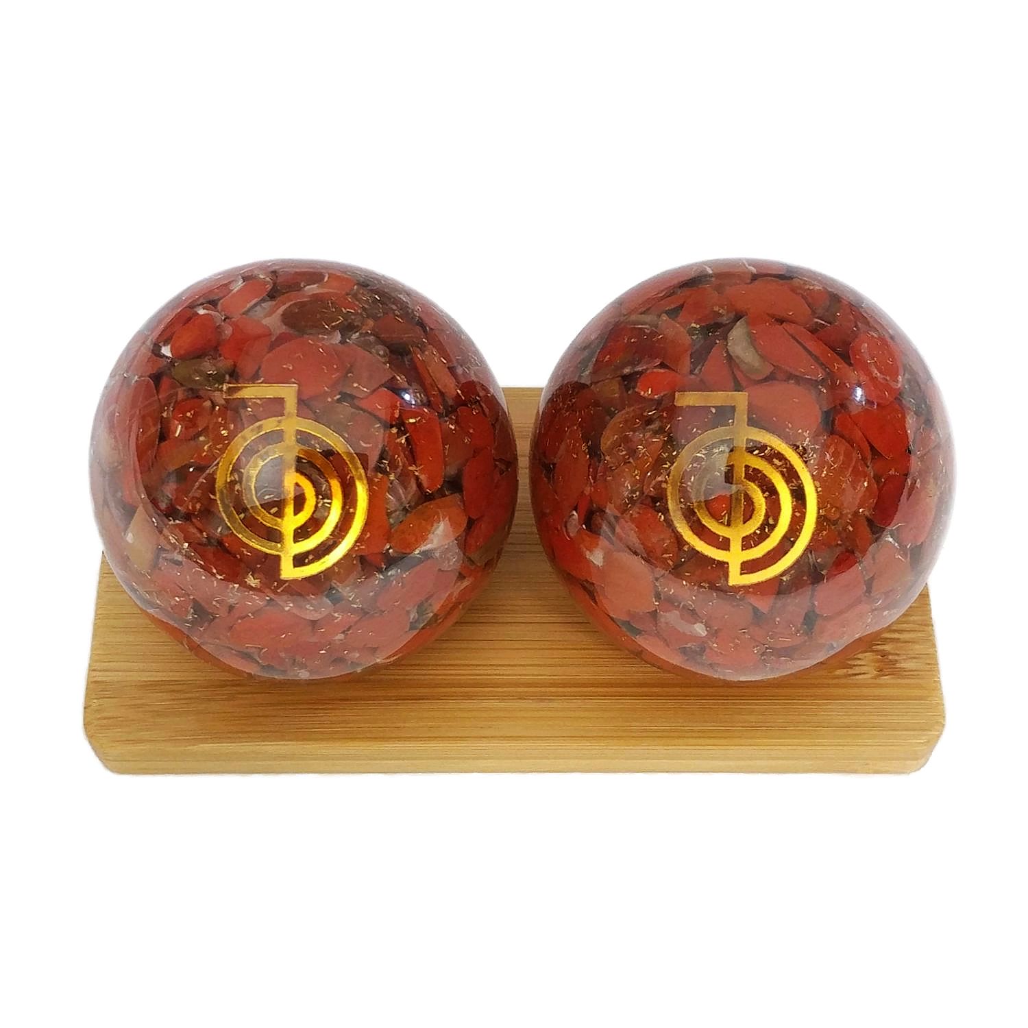 Red jasper orgonite baoding balls on bamboo stand