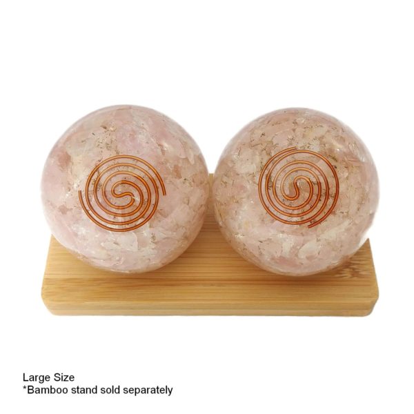 large rose quartz orgonite baoding balls on display stand