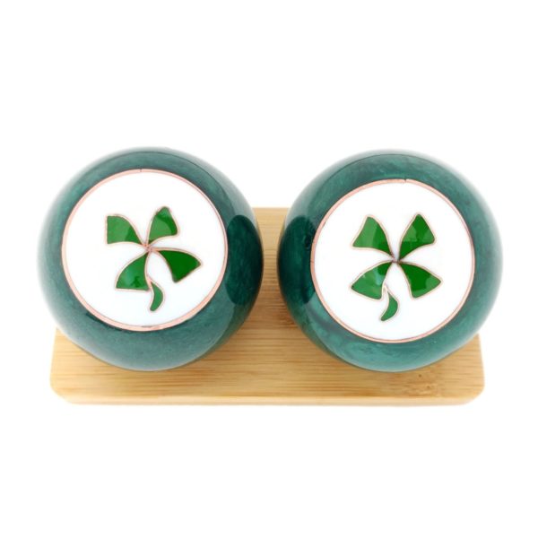 Four Leaf Clover baoding balls on a display stand