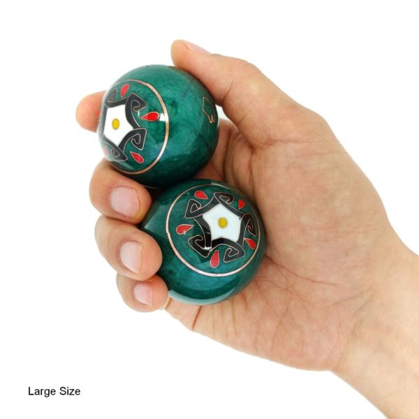 Hand holding medium size five elements baoding balls