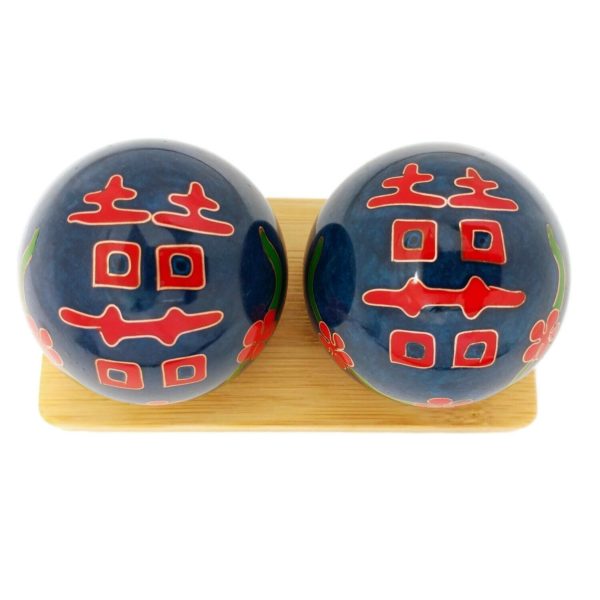 Double happiness baoding balls on a display stand