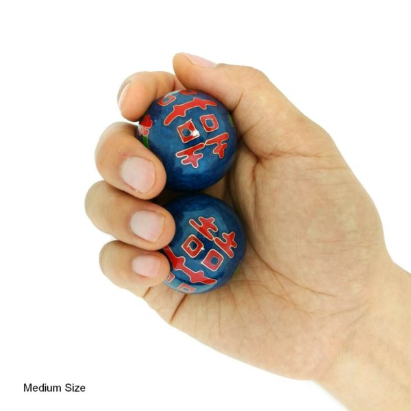 Hand holding medium double happiness baoding balls
