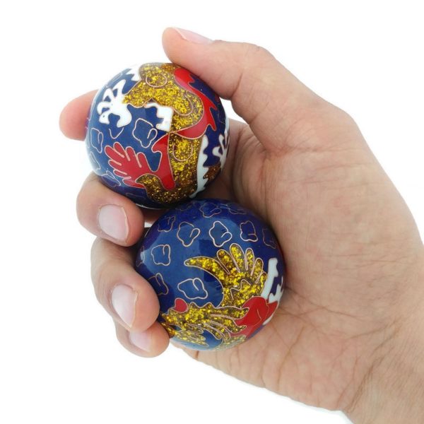 Hand holding large size premium dragon phoenix baoding balls