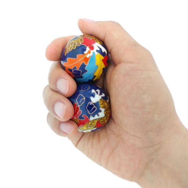 Hand holding medium size premium dragon phoenix baoding balls
