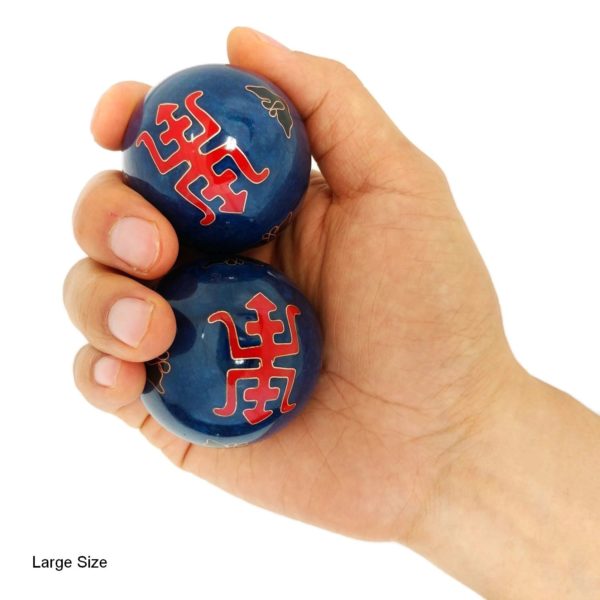 Hand holding large longevity baoding balls