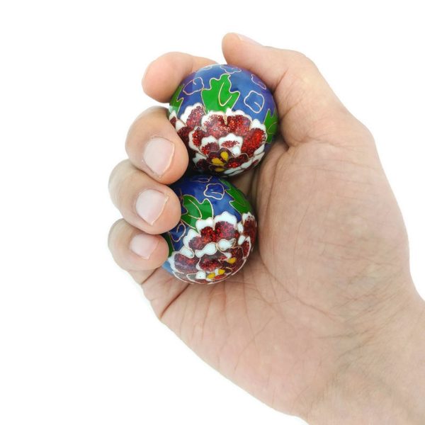 Hand holding medium size premium peony baoding balls