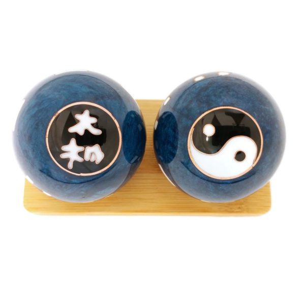 Tai Chi Yin Yang baoding balls on a display stand