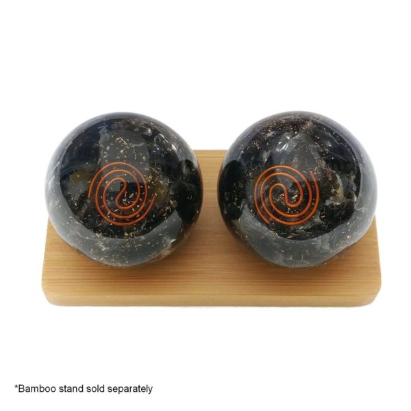Black obsidian orgonite baoding balls on a display stand