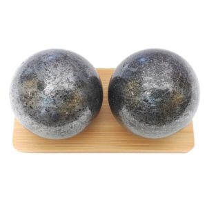 Hematite baoding balls on a display stand