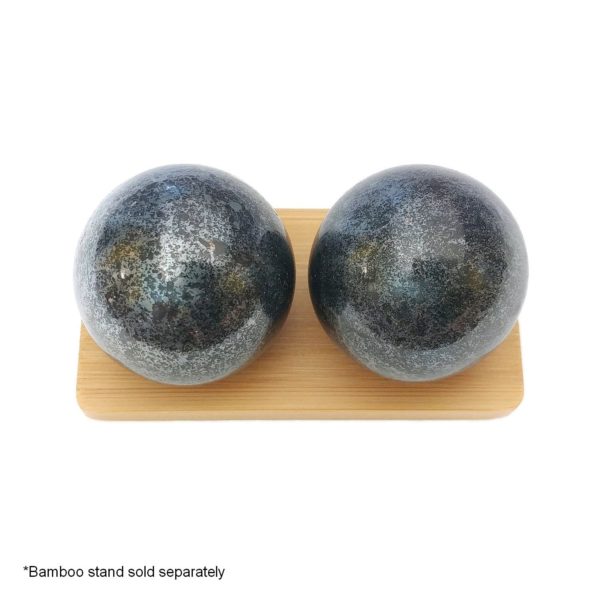 Hematite baoding balls on a display stand