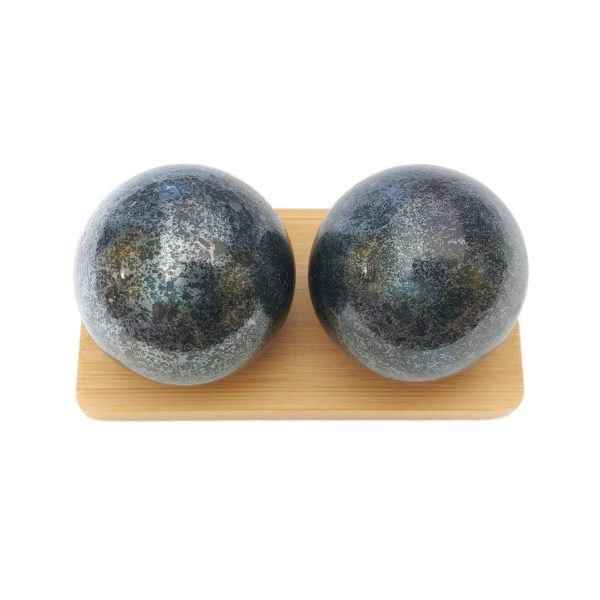 Hematite baoding balls on a display stand