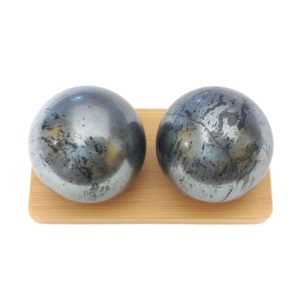 Hematite baoding balls on a display stand