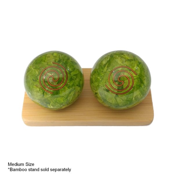 peridot quartz baoding balls on a bamboo stand