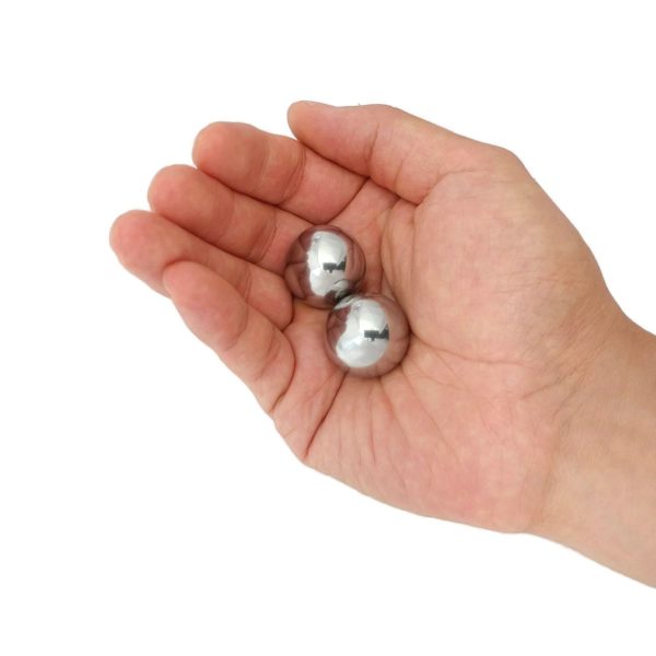 Hand holding 1 inch steel balls