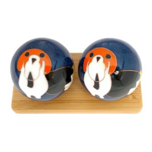 Dog baoding balls on a bamboo display stand