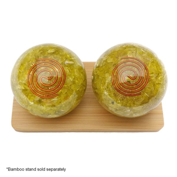 Lemon quartz orgonite baoding balls on bamboo display stand