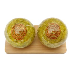 Lemon quartz orgonite baoding balls on bamboo display stand