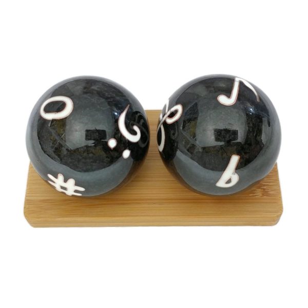 Music symbol baoding balls on a bamboo display stand