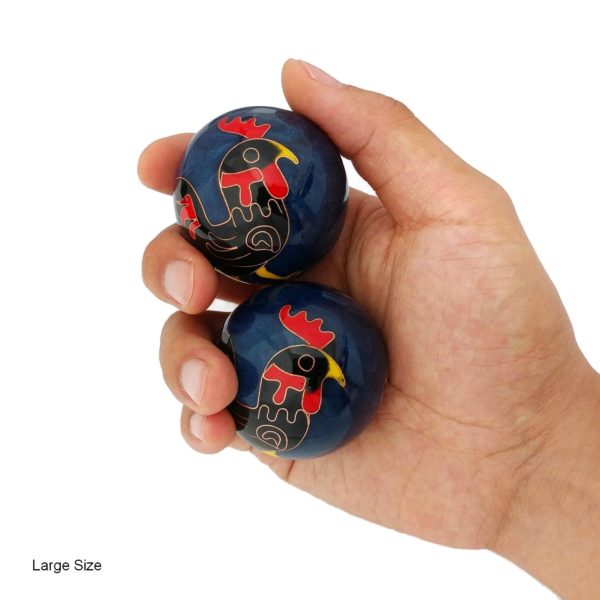 Hand holding large rooster baoding balls