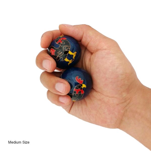 Hand holding medium rooster baoding balls