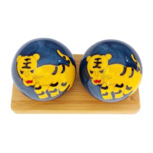 Tiger baoding balls on bamboo display stand