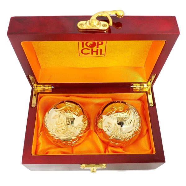 Gold dragon and phoenix baoding balls in a wood box