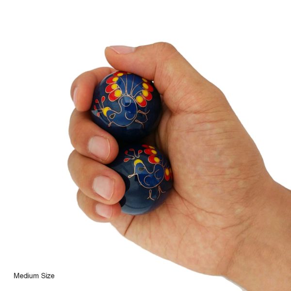 Hand holding medium size peacock baoding balls