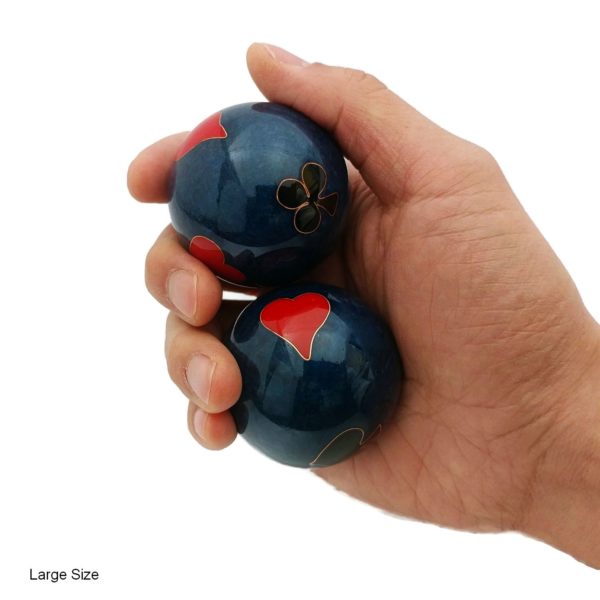 Hand holding large poker baoding balls